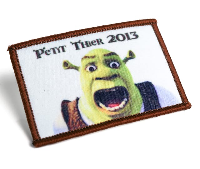 Rechthoekige full colour patch met een tekenfilmfiguur en gelockte rand